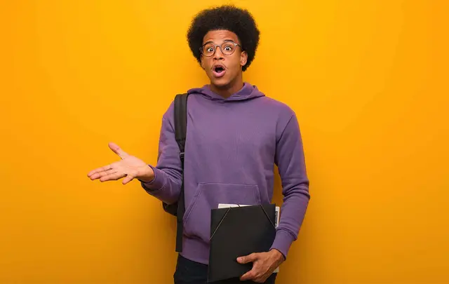 a surprised young man holding his hand out