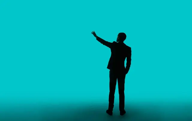 men in suits pointing up small image