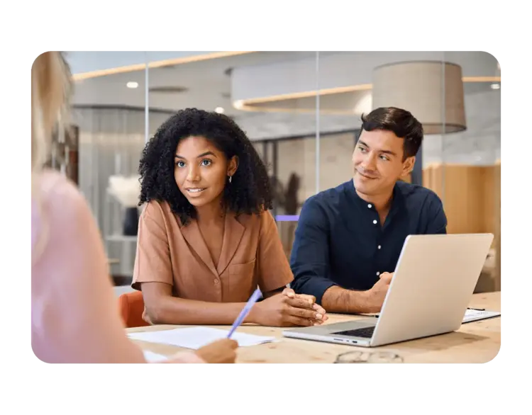 Image of people having a conversation at work