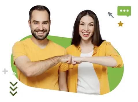 Two smiling people in yellow shirts bumping fists with a green background. 