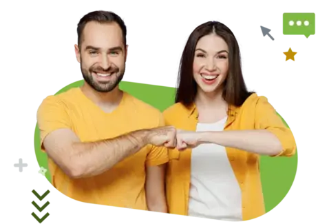 A man and woman wearing yellow shirts fist bumping, smiling cheerfully with a green background. 