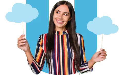 woman smiling with blue clouds in her hands