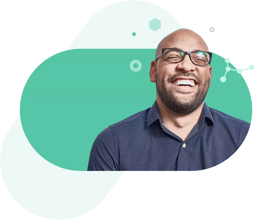 Smiling man with glasses on turquoise background representing Enterprise Resource Planning