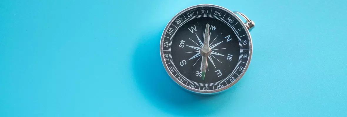 a compass on a blue background