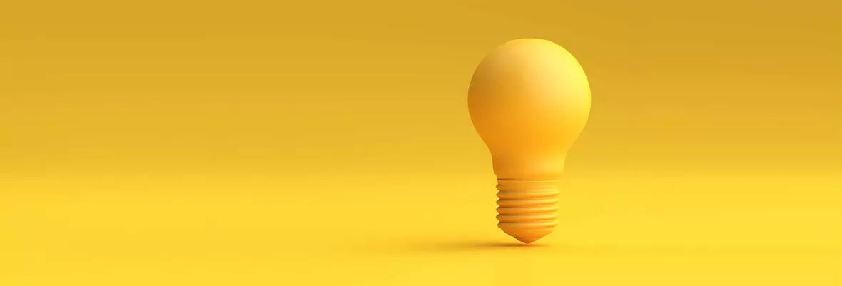 a yellow light bulb with a yellow background