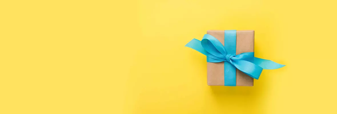 a parcel with a blue ribbon on a yellow background