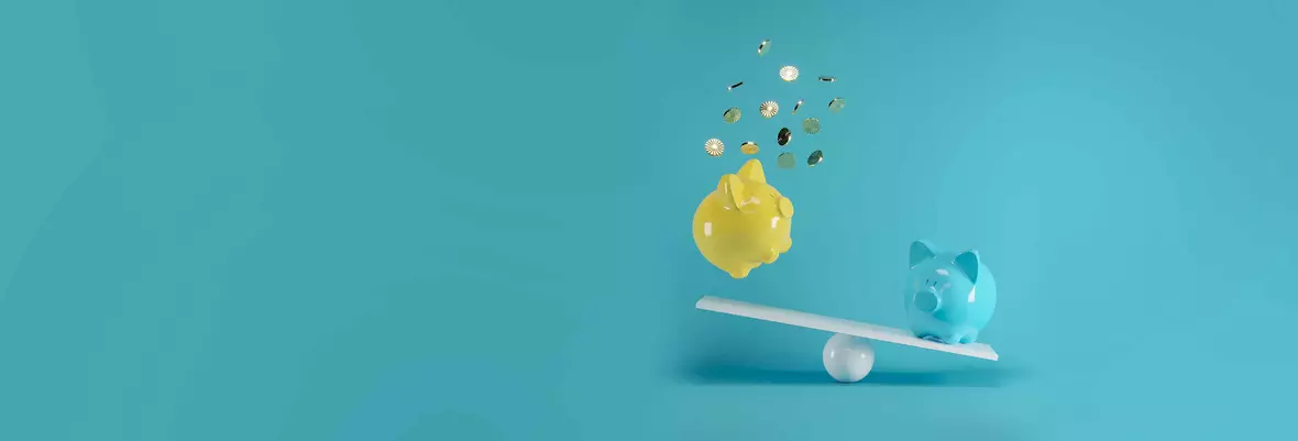 a blue and a yellow piggy bank on a seesaw. One piggy bank is losing its money