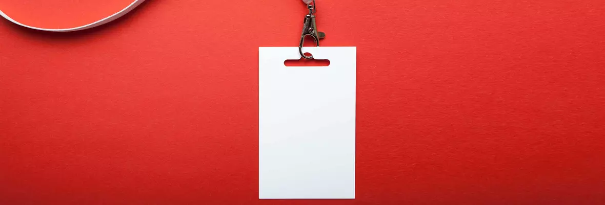 blank white ID on a white lanyard on a red background