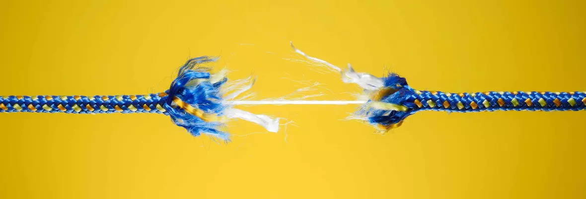 breaking rope on yellow background