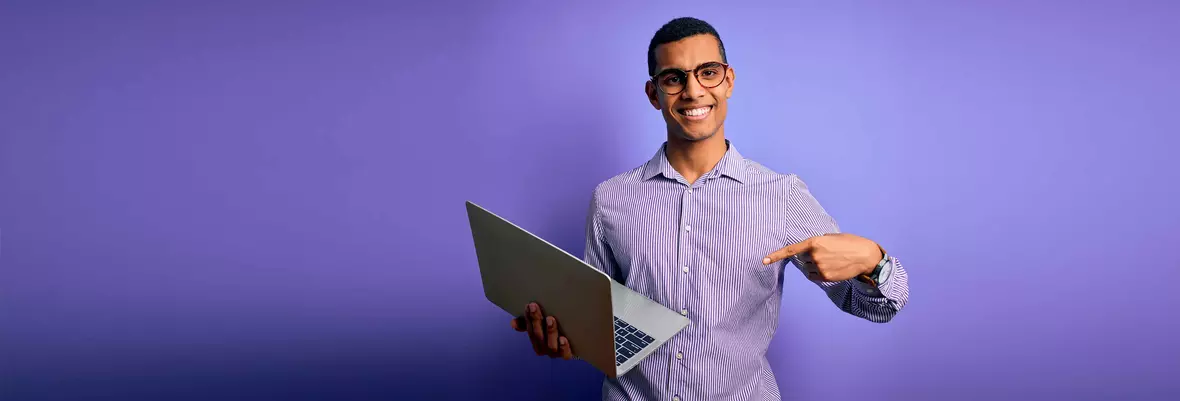 person pointing at computer