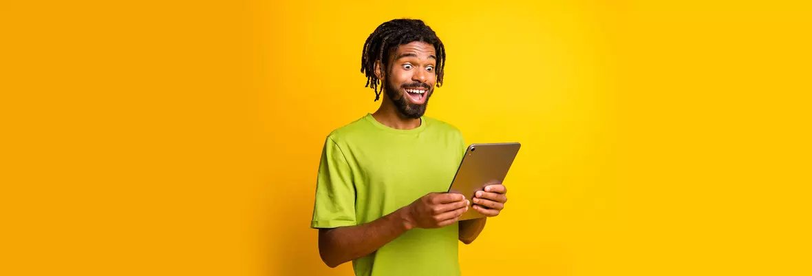 person looking happy at tablet