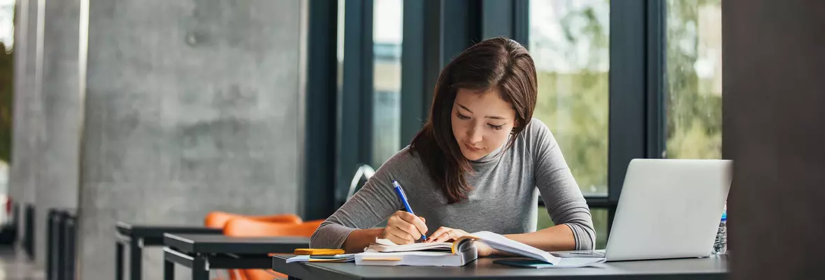 person studying with laptop