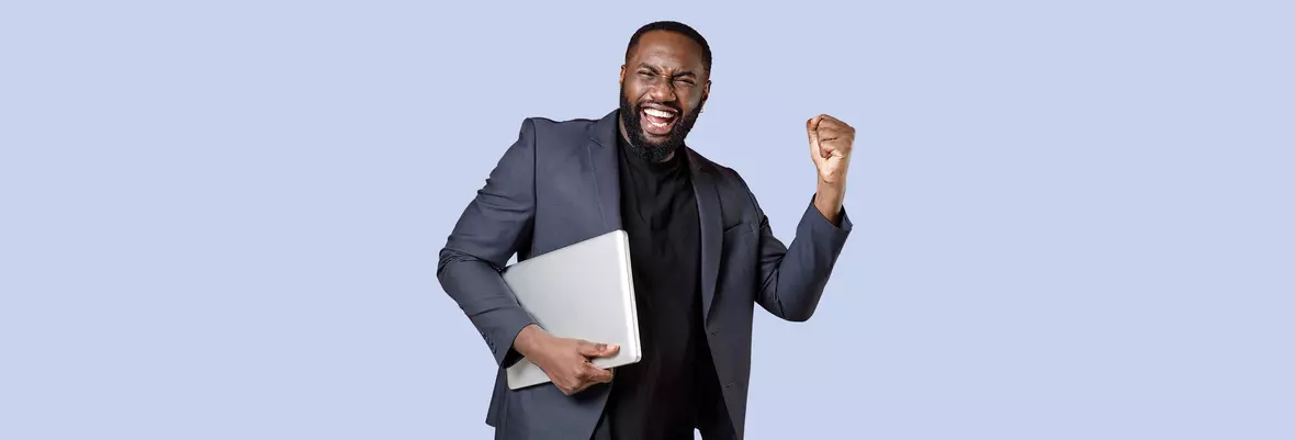 person cheering with laptop