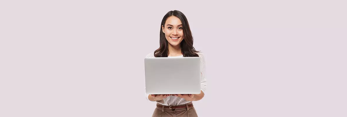 person smiling with laptop