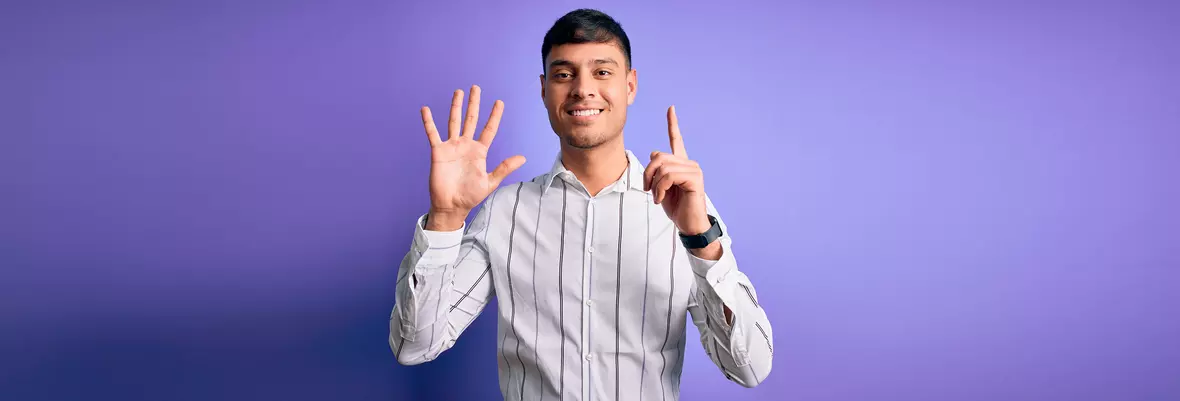 man holding up 6 fingers 