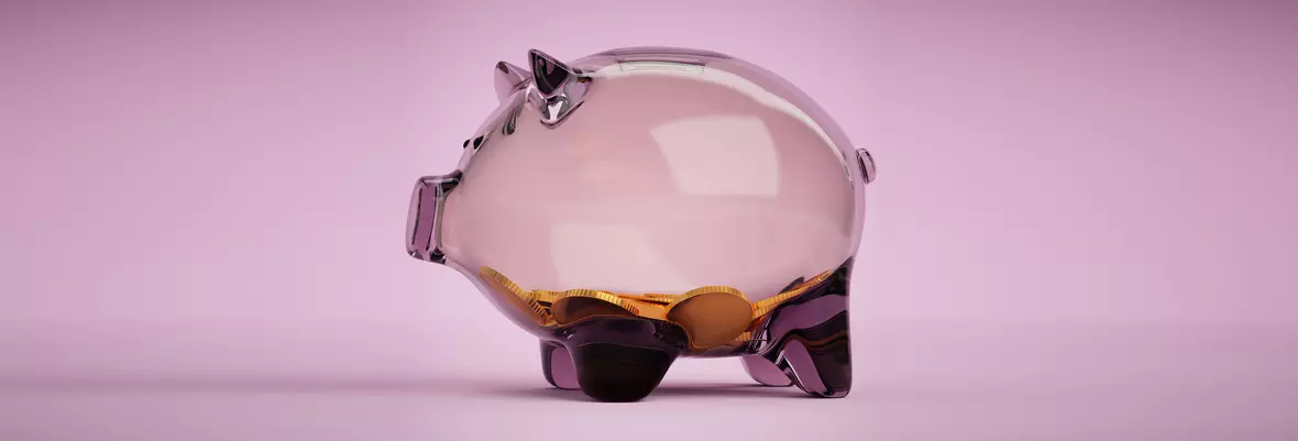 transparent piggy bank with coins