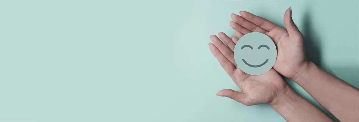 smiley face in hands