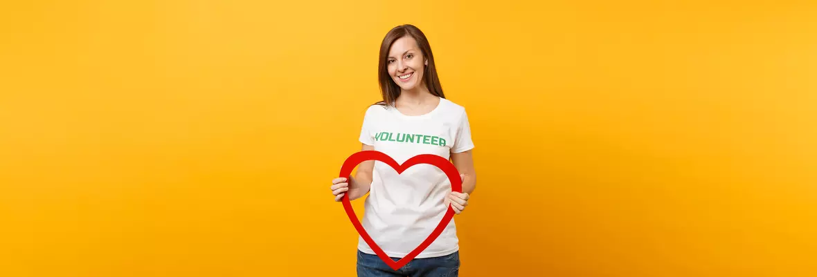 woman with volunteer tshirt and red heart
