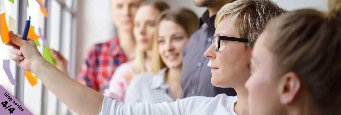 team looking at sticky notes