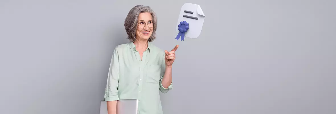 woman smiling holding laptop pointing to contract