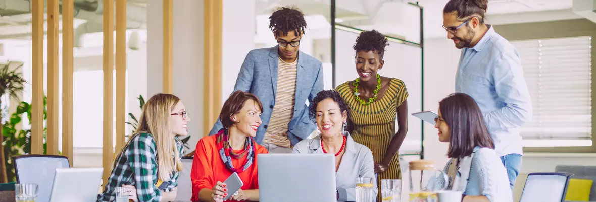 People diversity around a computer in an office