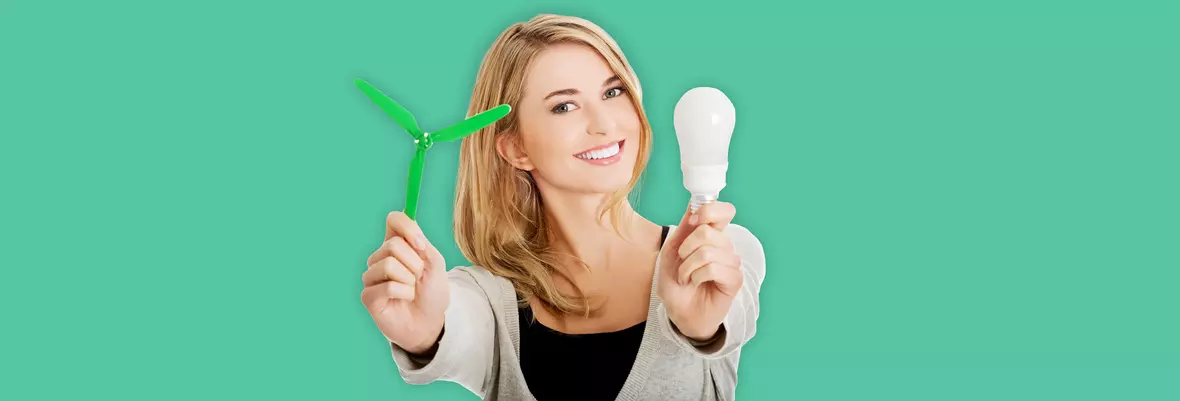 Smiing woman holding a lightbulb and a small fan