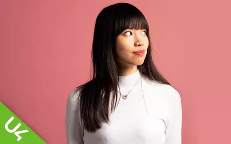 woman, smiling and looking over her left shoulder