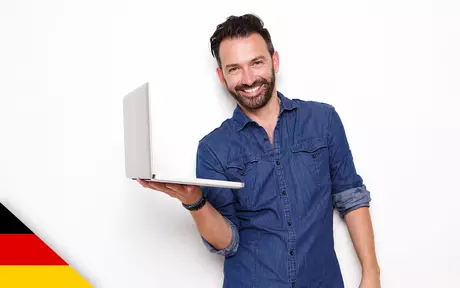 Smiling man with laptop