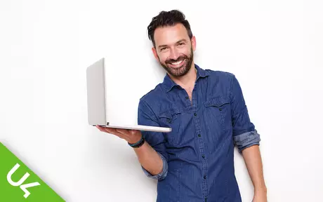 Smiling man with laptop