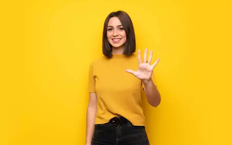 Young woman holding out her hand to represent 5 things