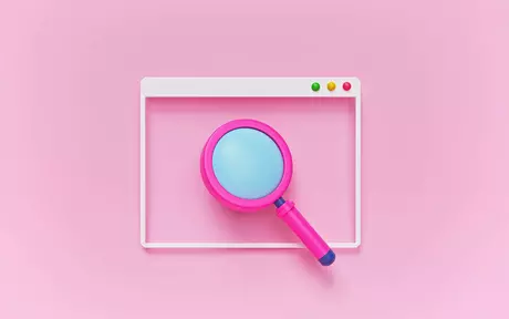 magnifying glass on pink background