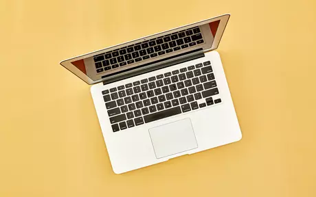 laptop on orange background