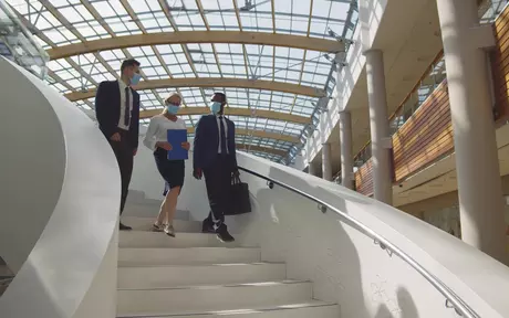people walking on stairs, face masks