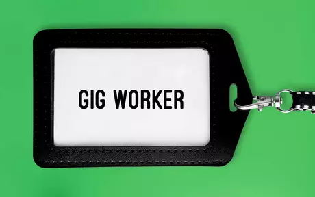 gig worker tag on chain with green background 