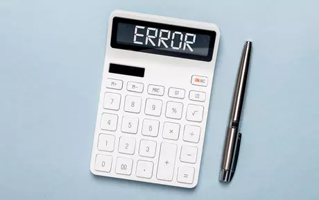 calculator with error and pen 