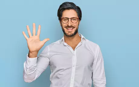 man with glasses waving