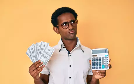 men with money and calculator