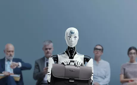 Robot with a brief case sitting in front of people