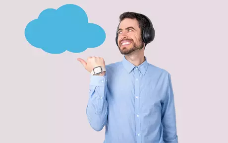 man with headphones pointing to a cloud