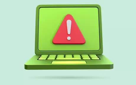 laptop with a warning signal
