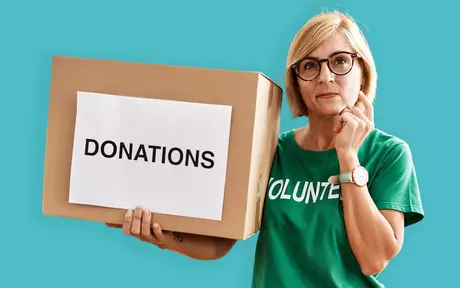 woman with a box saying donations
