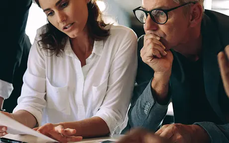 people reviewing a document
