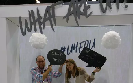A man and woman holding up speech bubbles saying "Send Help"