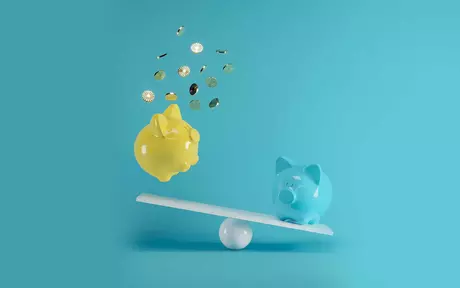 a blue and a yellow piggy bank on a seesaw. One piggy bank is losing its money