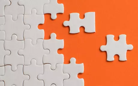 Puzzle on orange background