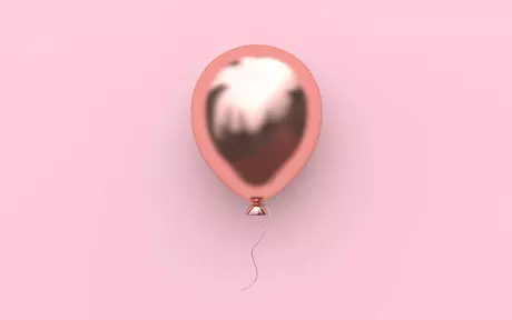 Pink balloon on pink background