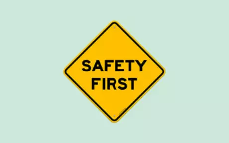 Safety first sign on green background