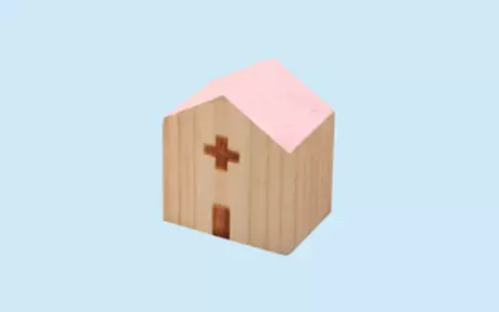 Wooden house with cross on blue background