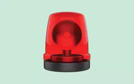 Red emergency light on green background