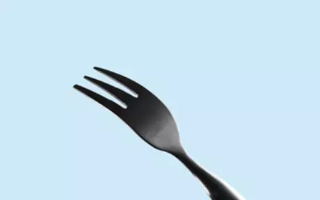 Fork on light blue background